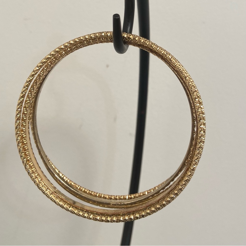 Gold Tone Women etched 7 stackable bracelets bangles. Used.